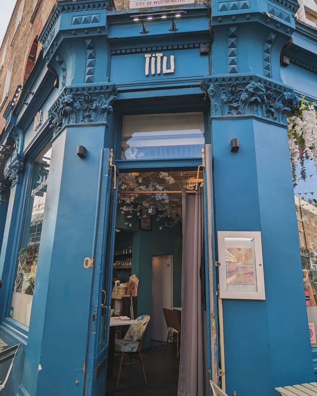 The blue shopfront entrance of TITU in Shepherd Market, Mayfair