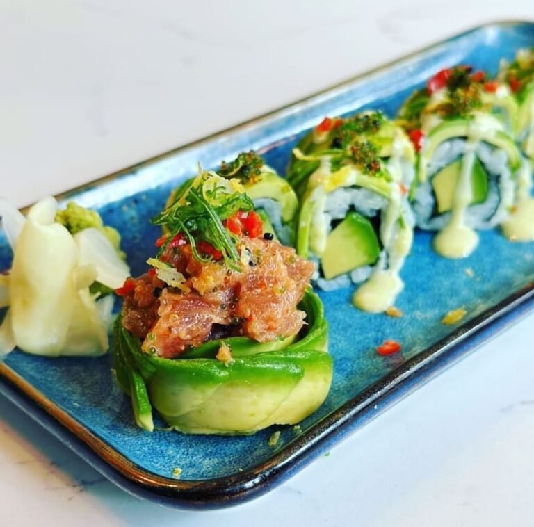 Cucumber wrapped rolls topped with spicy tuna at Titu, London