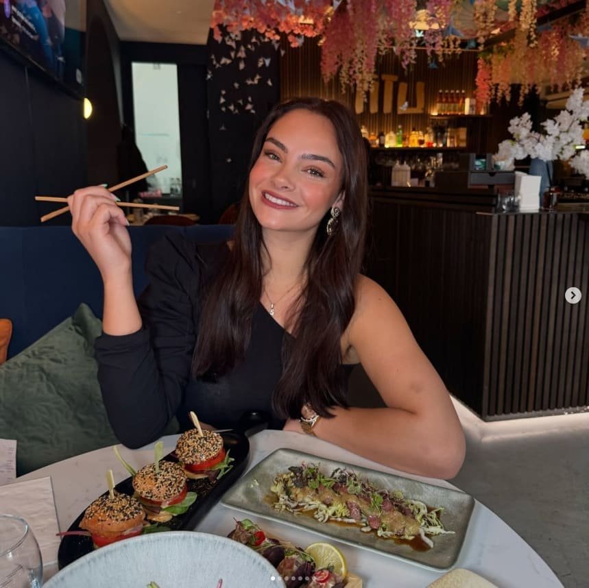 Guest enjoying sushi with chopsticks at Titu Japanese restaurant London