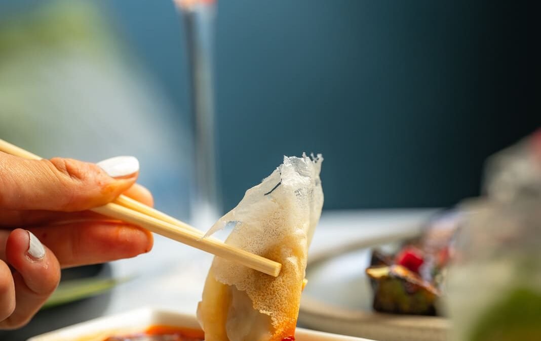 Gyoza dipped in sauce selection at Japanese restaurant in London