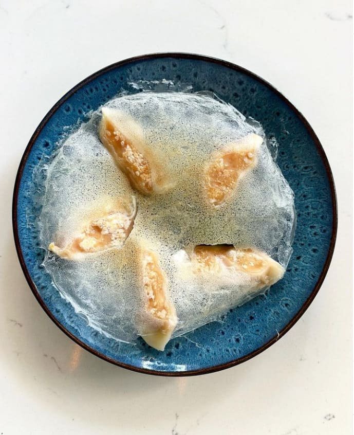 Gyoza with the crisp lace skirt across the base, served at Titu