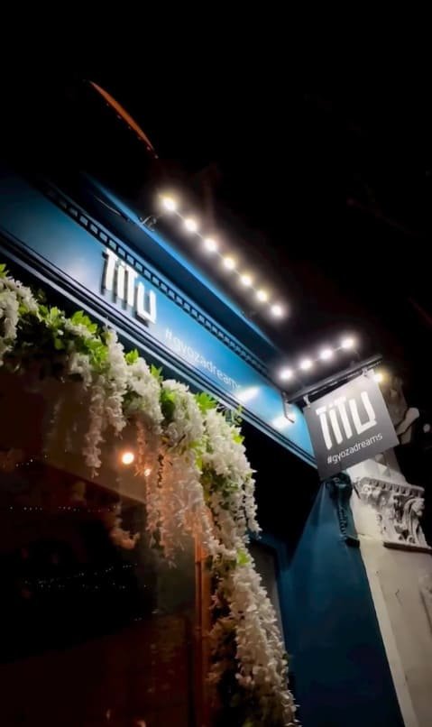 Illuminated Titu sign outside Japanese fusion restaurant in London