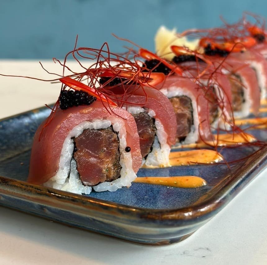 Tuna wrapped sushi rolls with tobiko at Titu London