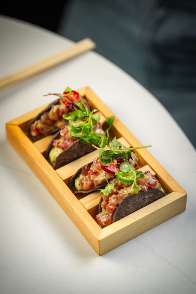 Wagyu tacos lined up on a wooden board at Titu, Mayfair